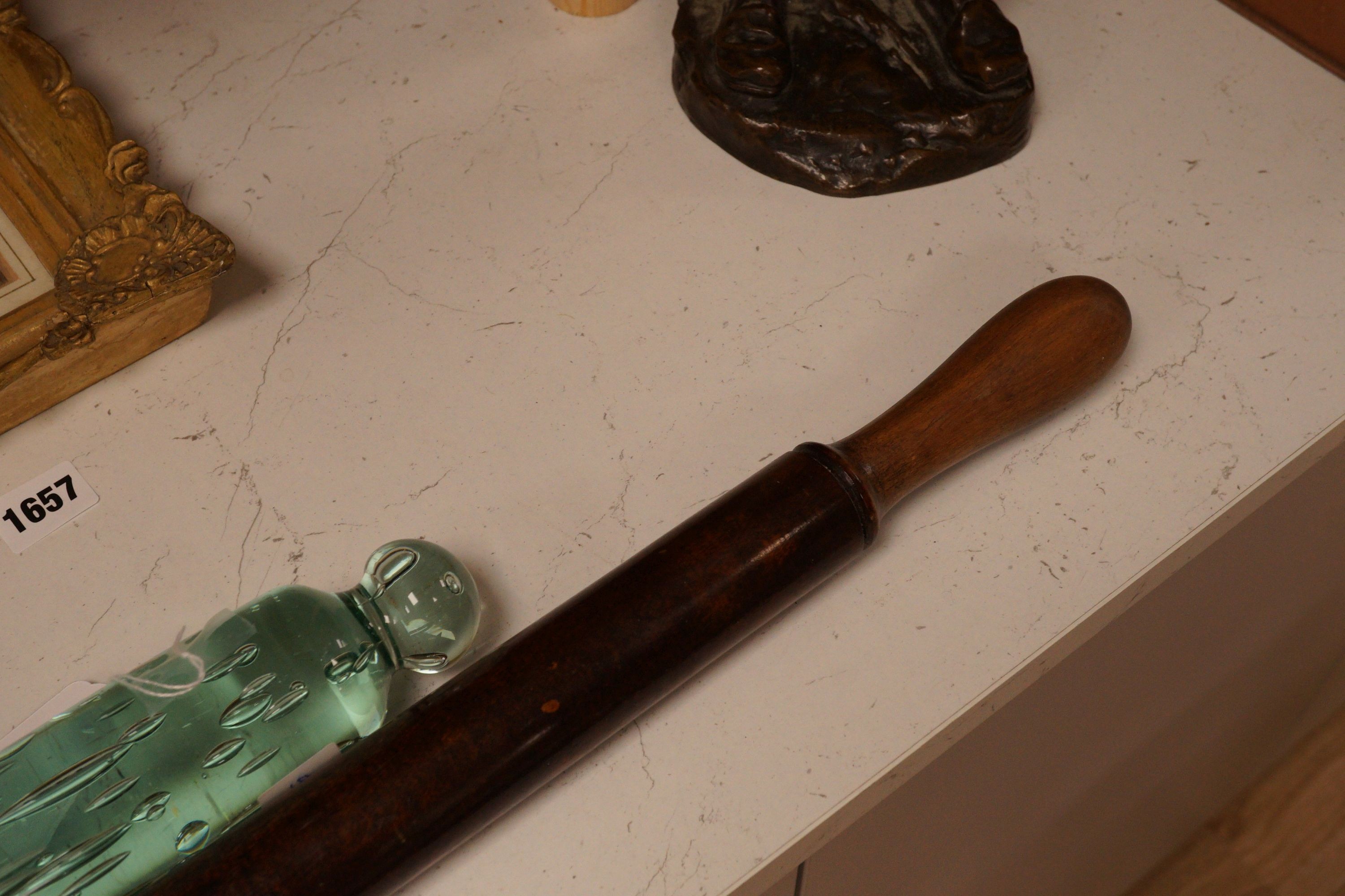 A Victorian glass rolling pin together with a turned wooden example, widest 82cm (2)